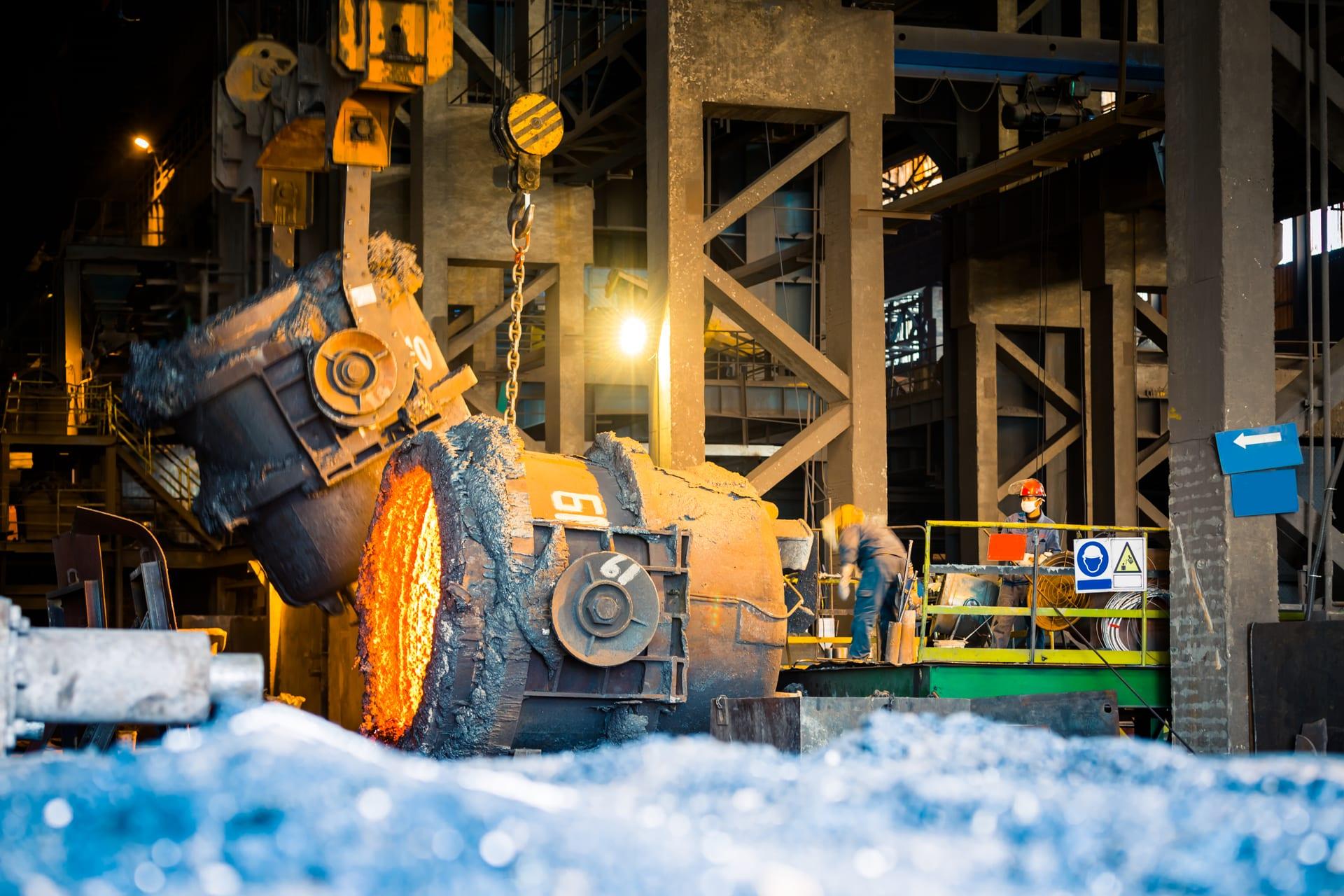 Overhead crane and ladle inside a working foundry